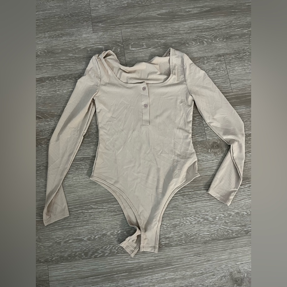 Beige long sleeve body suit with buttons